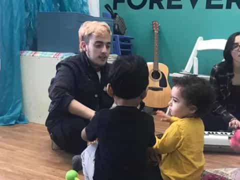 a person and a group of children