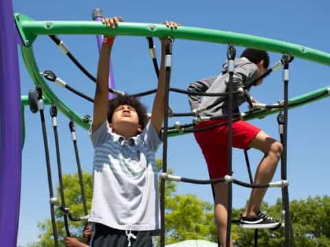 a man and a woman on a swing set