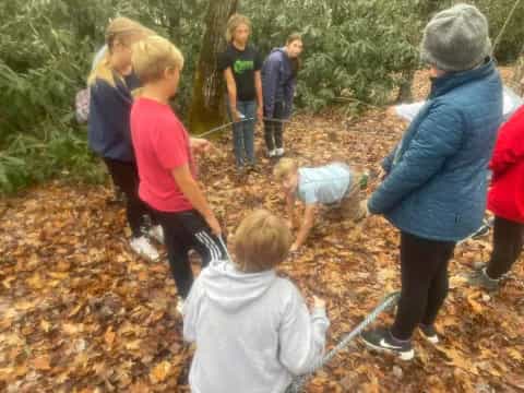 a group of people in the woods