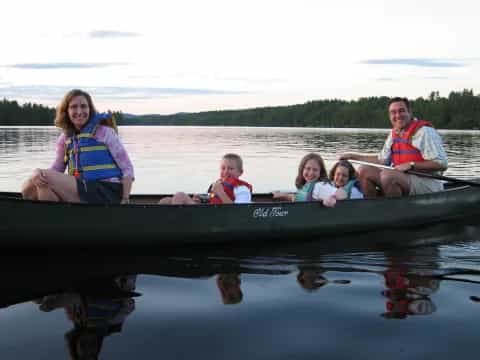 a group of people in a canoe