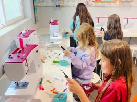 a group of children painting