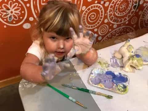 a baby sitting at a table