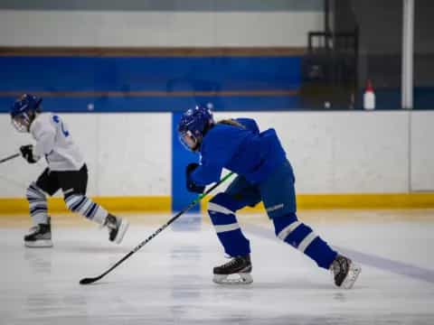 two men playing hockey