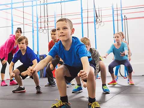 a group of kids in a gym