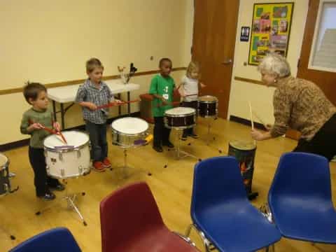 a group of people playing drums