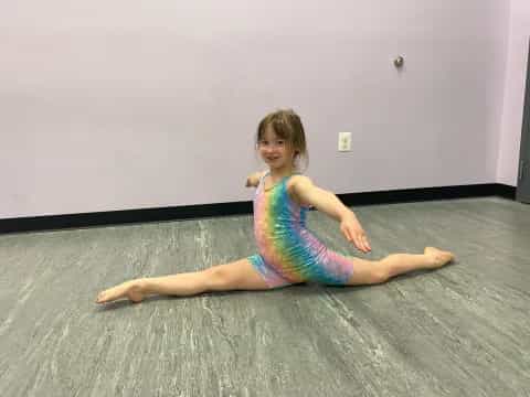 a girl sitting on the floor