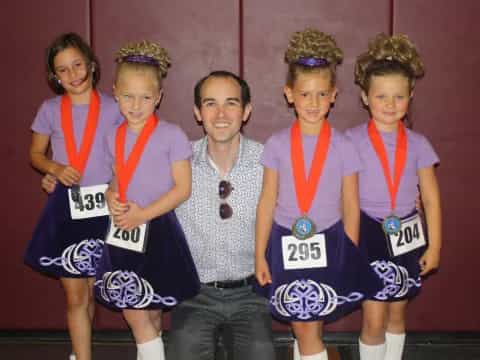 a group of people wearing medals