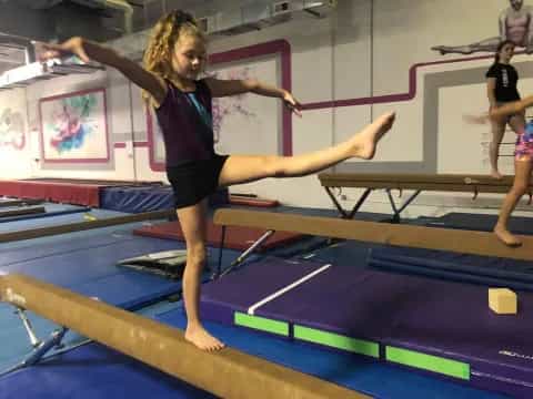 a woman doing gymnastics