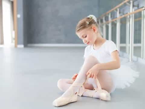 a girl sitting on the floor