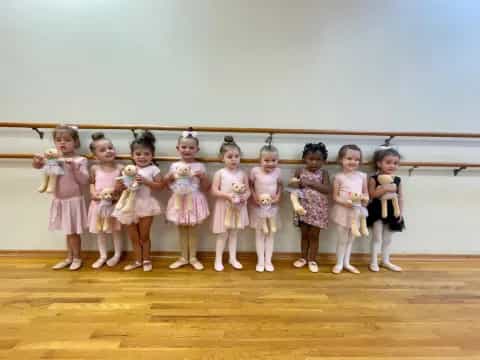 a group of girls in dresses
