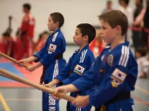 a group of boys in blue uniforms