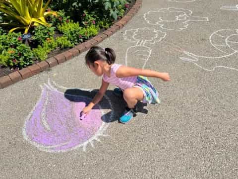 a girl playing in the street