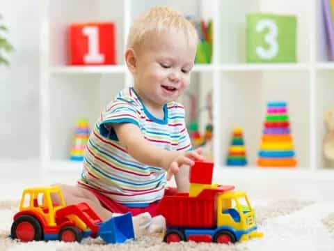 a baby playing with toys