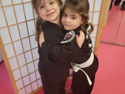 a couple of children hugging