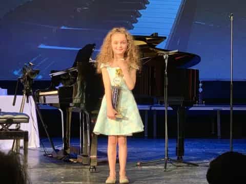 a woman standing on a stage