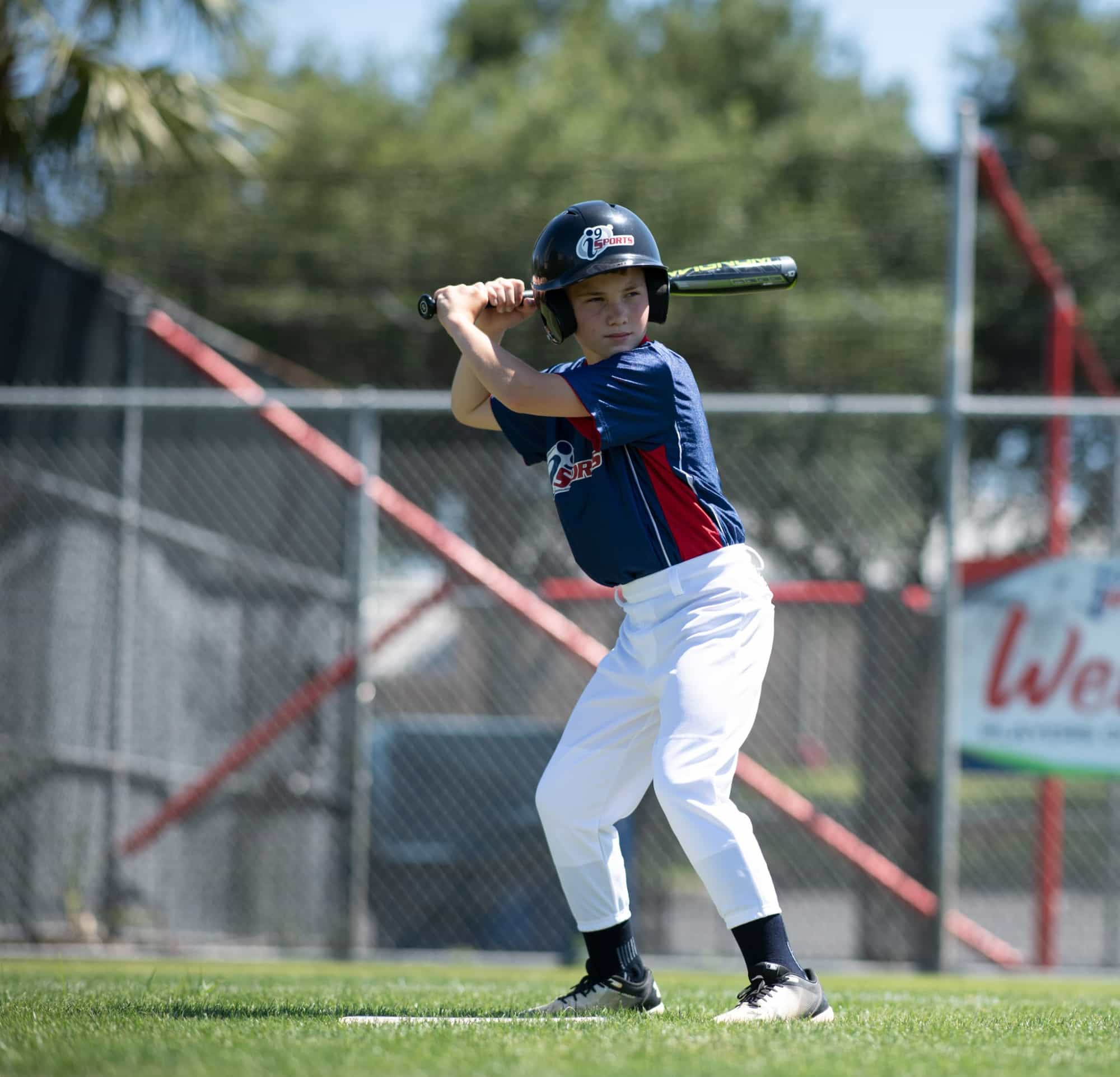 a young boy playing baseball