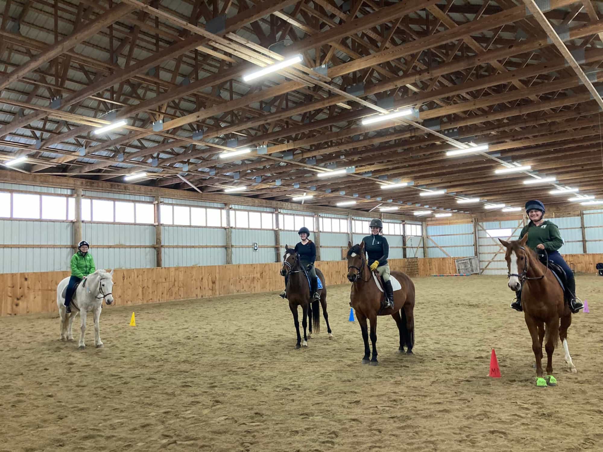 a group of people riding horses