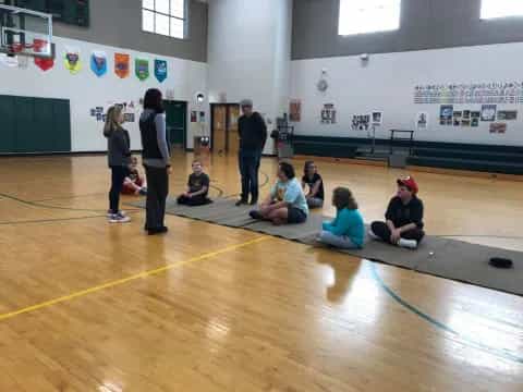 a group of people in a gym