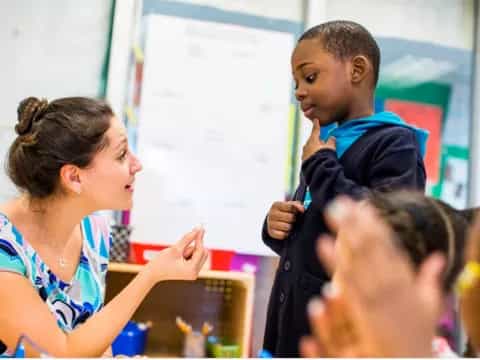 a teacher teaching a student