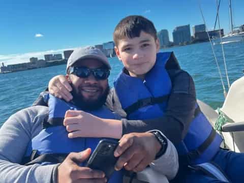 a person and a boy on a boat