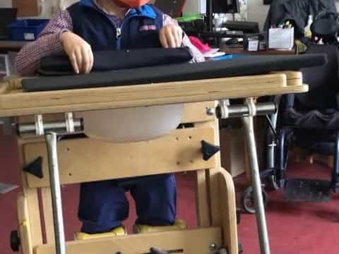 a boy sitting at a desk