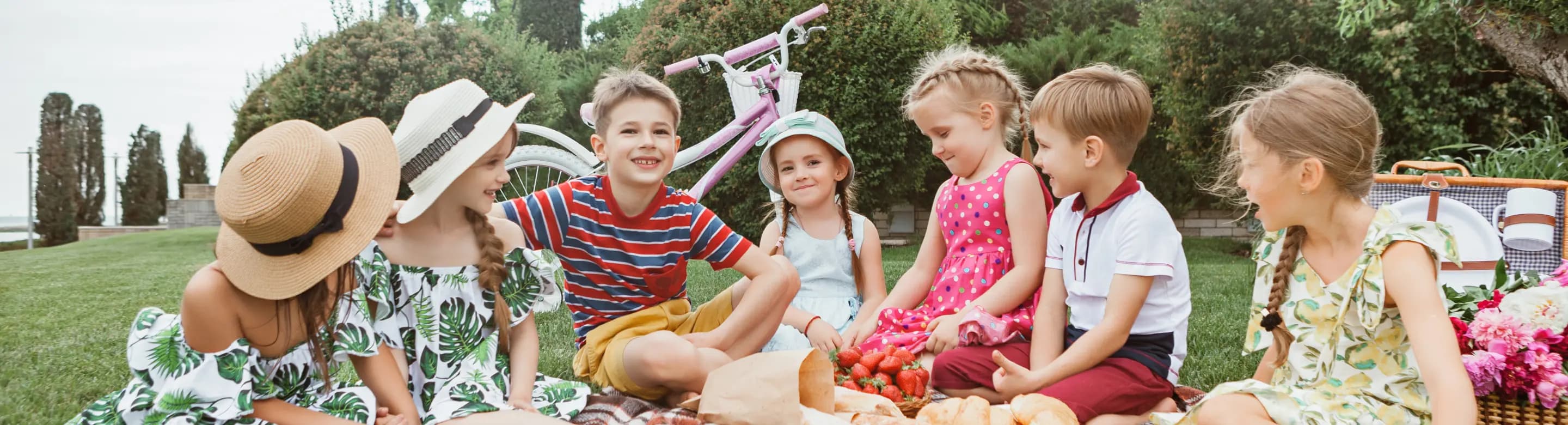 Kids sitting on the grass