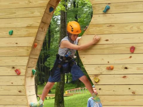 a person climbing a wooden wall