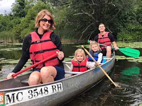 a group of people in a canoe