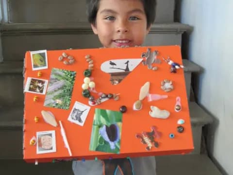 a boy holding a board