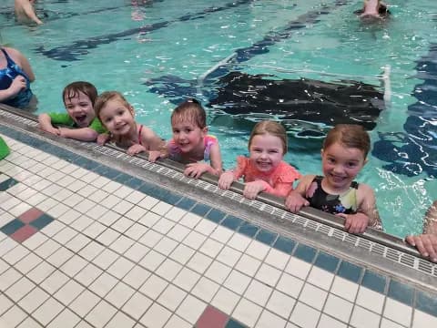 a group of kids in a pool