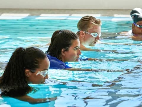 a group of people in a pool