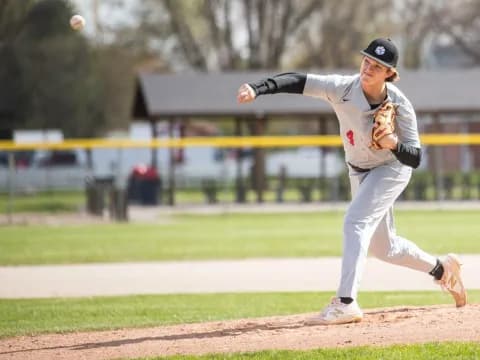 a baseball player throwing a ball