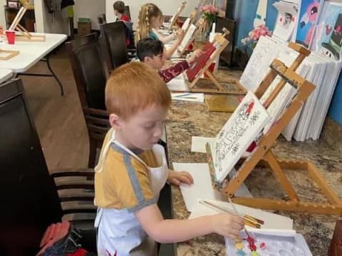 a group of children painting