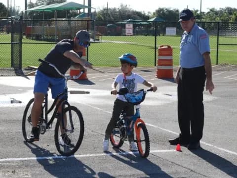 a man and a boy on bicycles