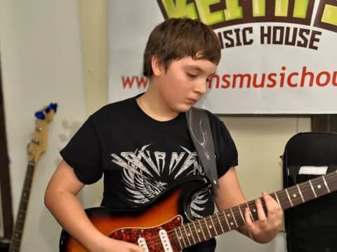 a person playing a guitar