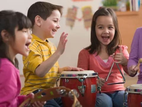 a group of kids playing drums