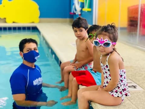 a group of kids in a pool