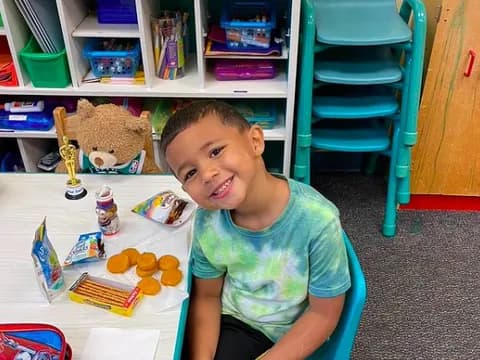 a boy sitting at a table