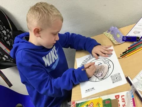 a child drawing on a paper