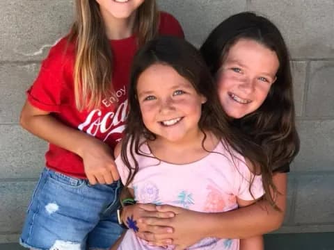 a group of girls smiling