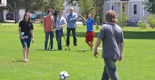 a group of people playing football