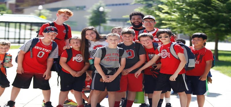 a group of people wearing matching t-shirts and running