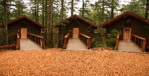 a wooden building with a walkway