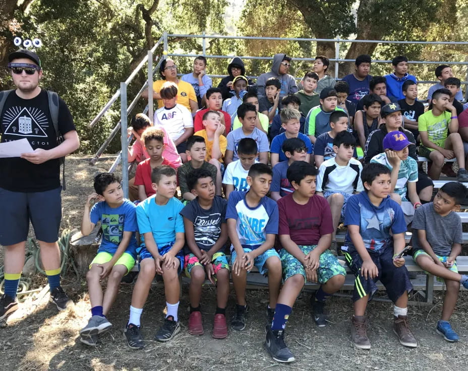 a group of kids posing for a photo