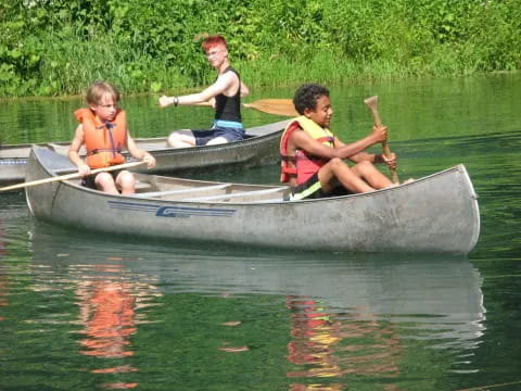 a group of people in a canoe