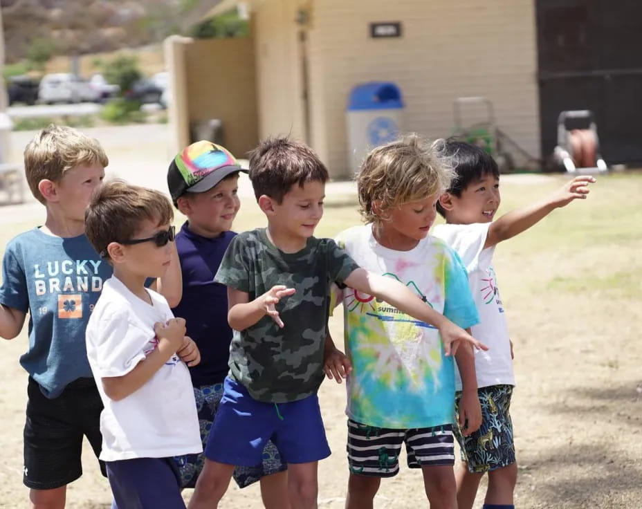 a group of kids playing outside