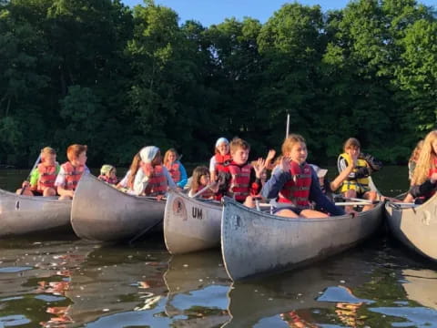 a group of people on boats
