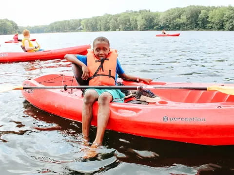 a person in a red canoe
