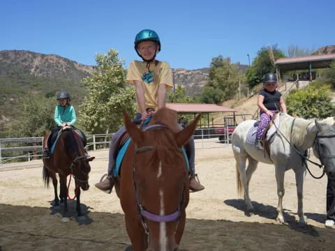 a group of people riding horses