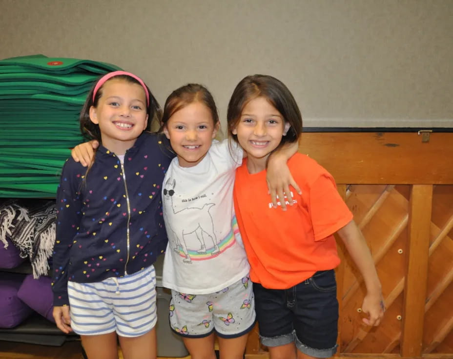 a group of girls posing for a photo